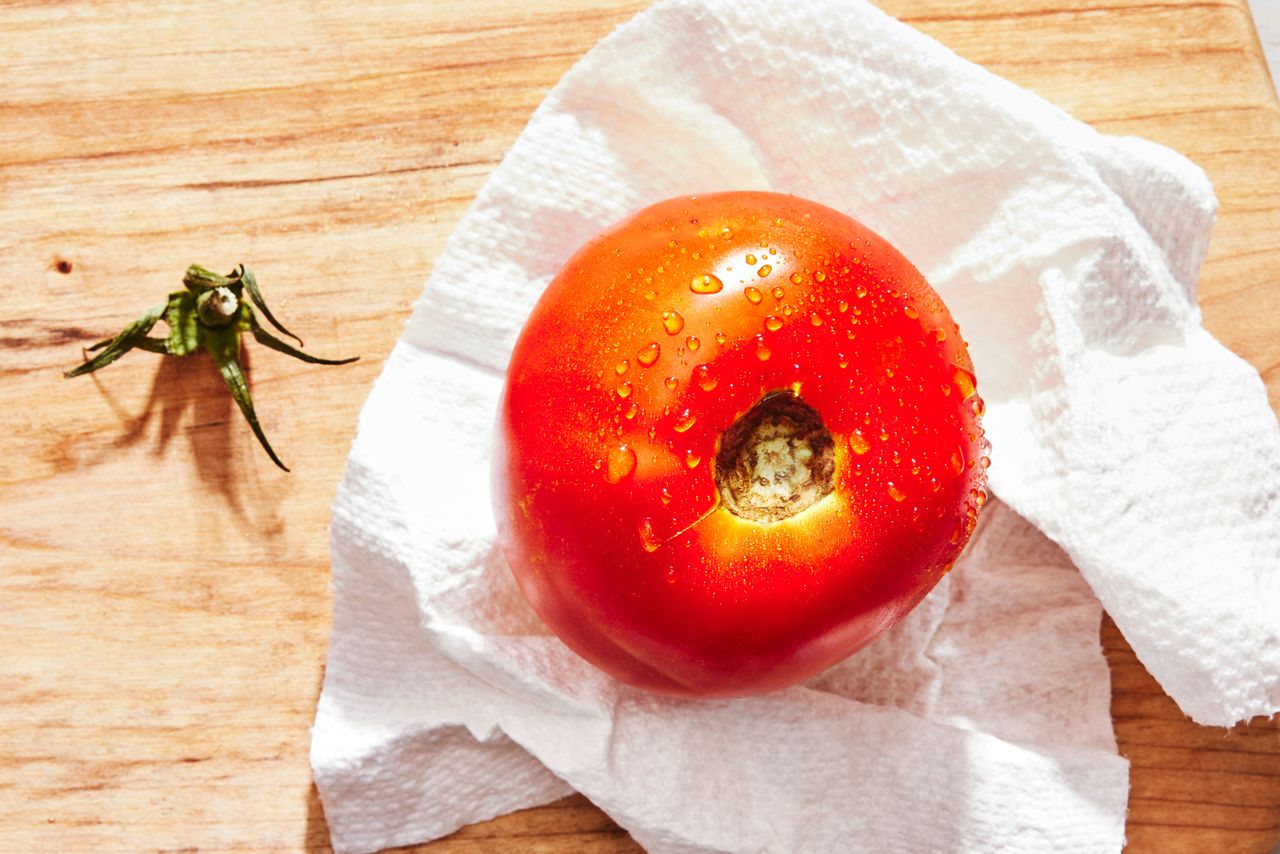 Southern Living How to Dice Tomatoes washing the tomato and removing the stem