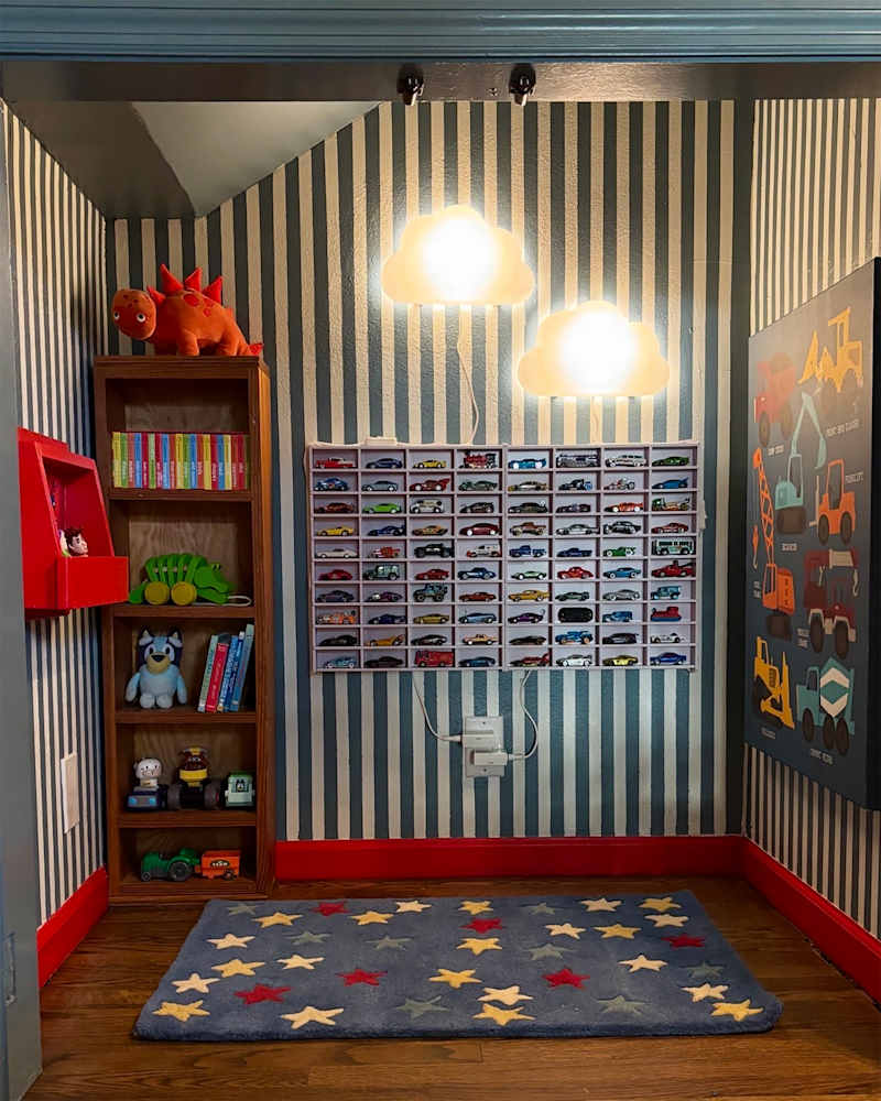 Striped blue and white walls in renovated kids nook.