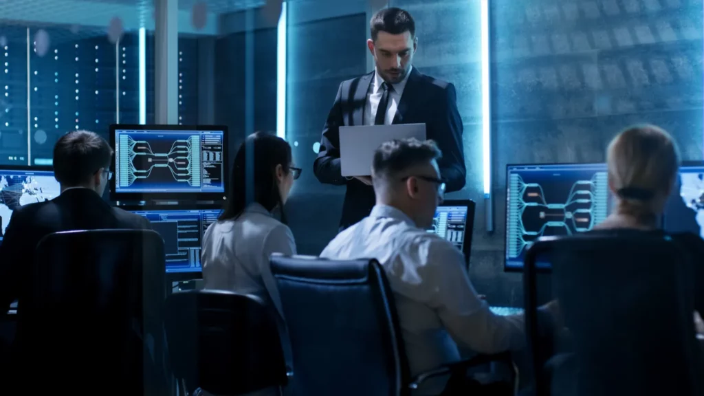 Engineers working in system control center full