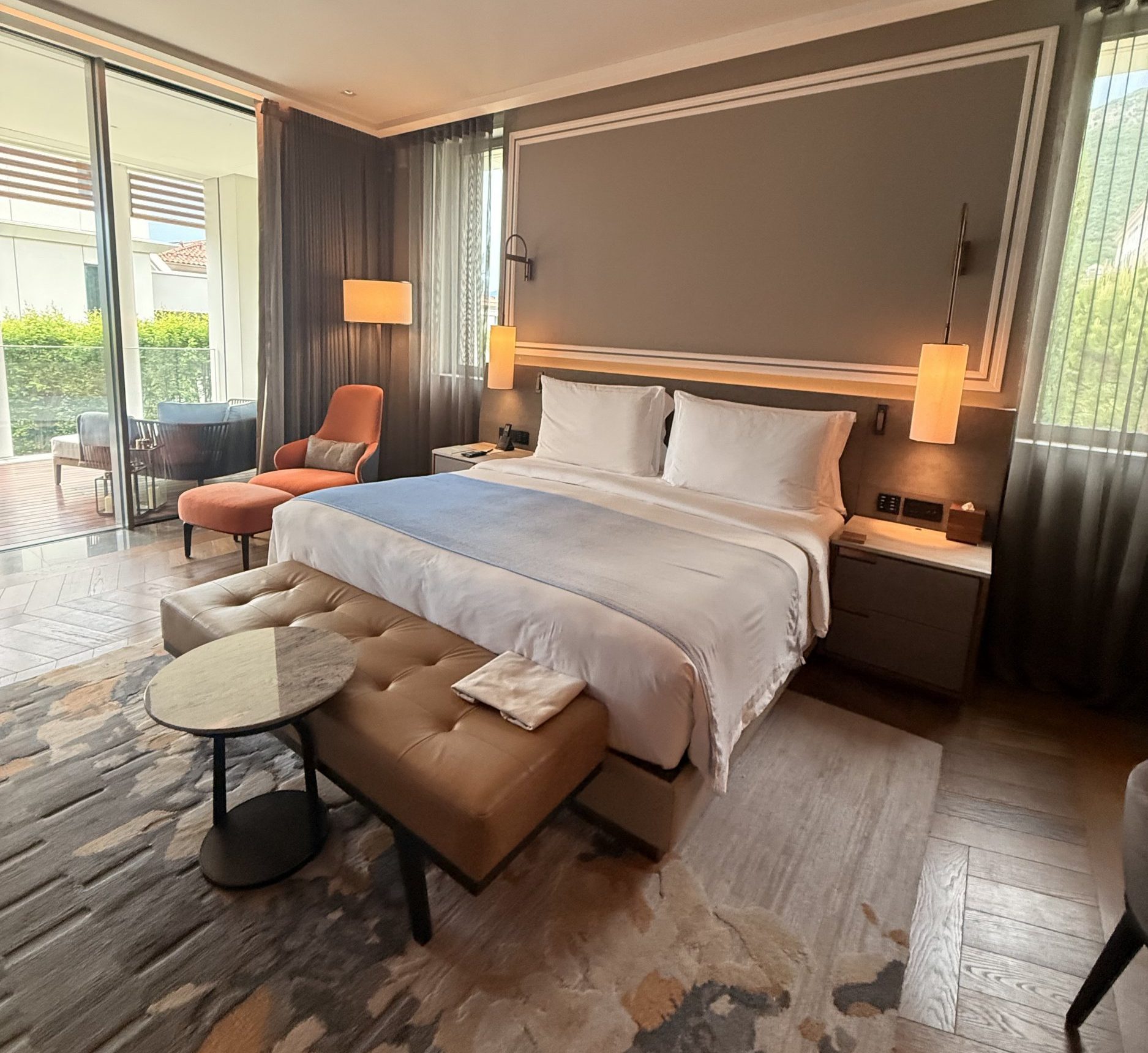 A large double bed in a hotel room in Montenegro