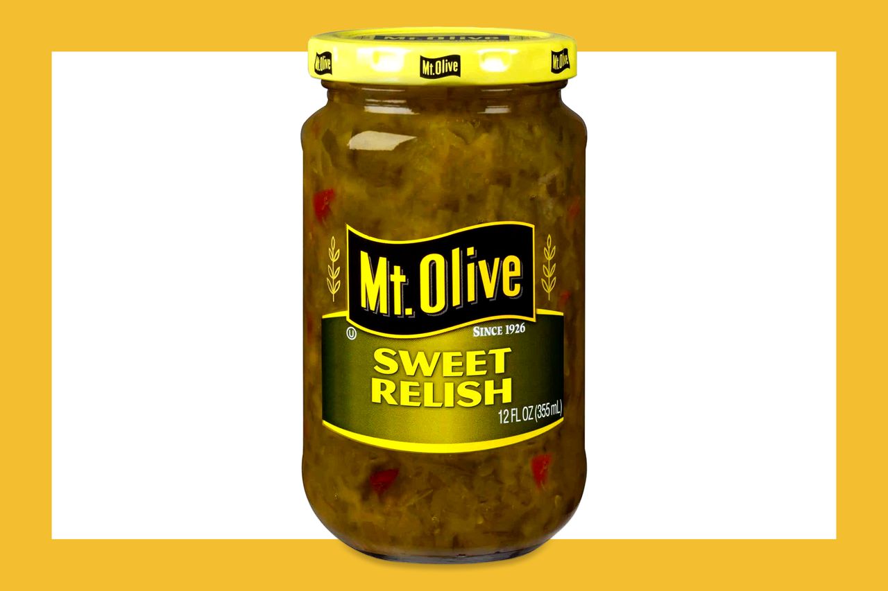 A jar labeled Mt Olive Sweet Relish on a yellow background