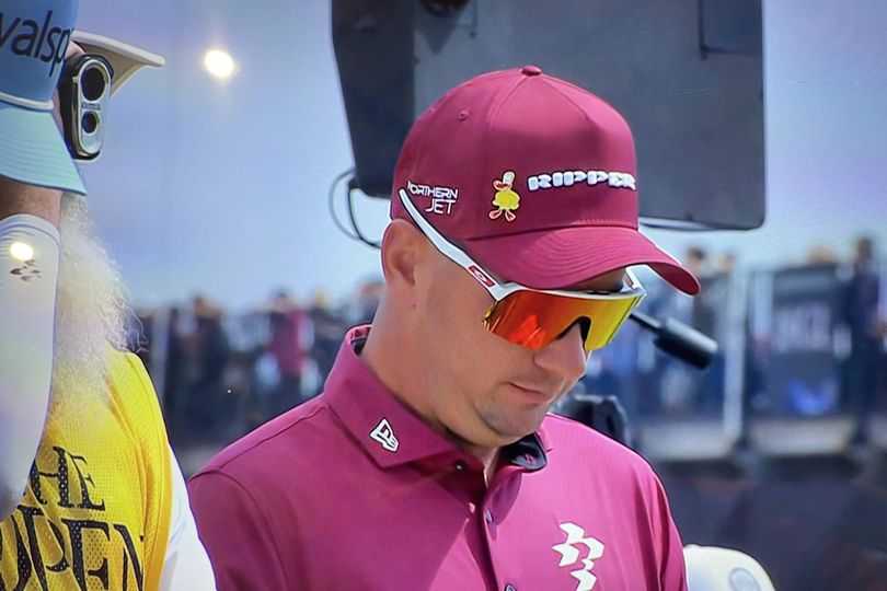 Open Championship rules controversy averted after leader's caddie caught on camera