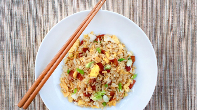 Plate of fried rice with chopsticks