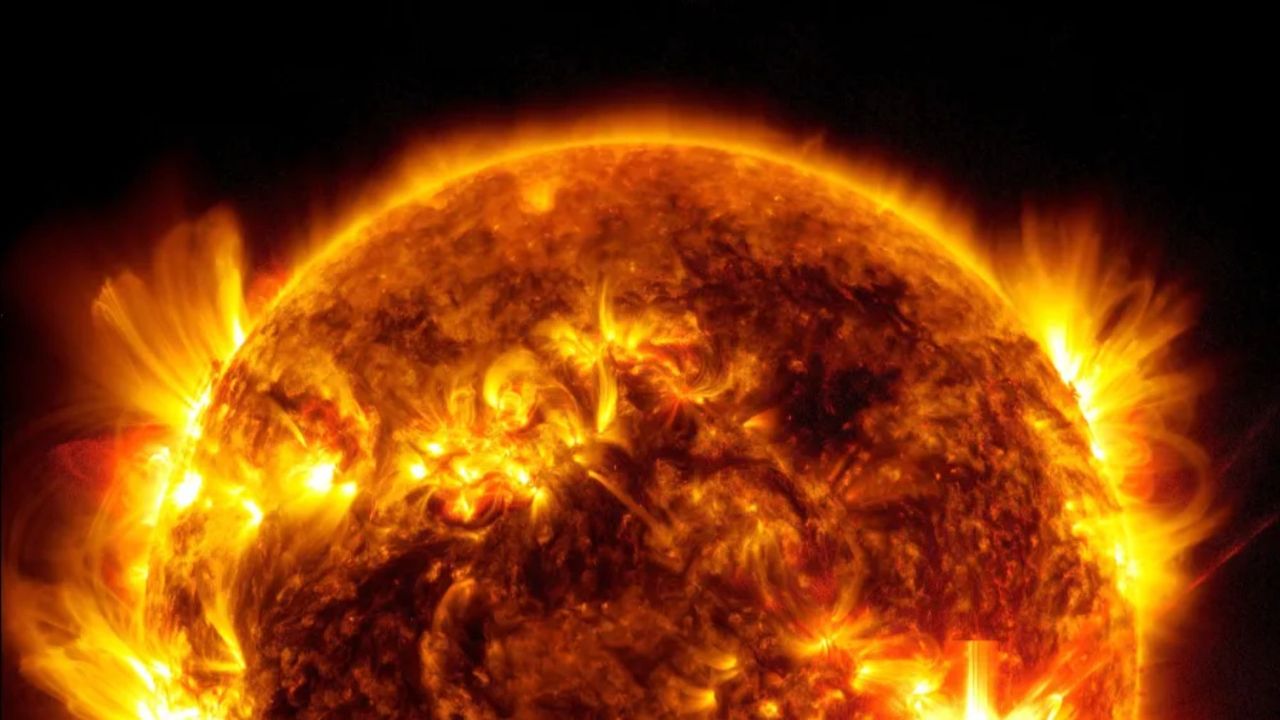 The top hemisphere of a fiery yellow ball.