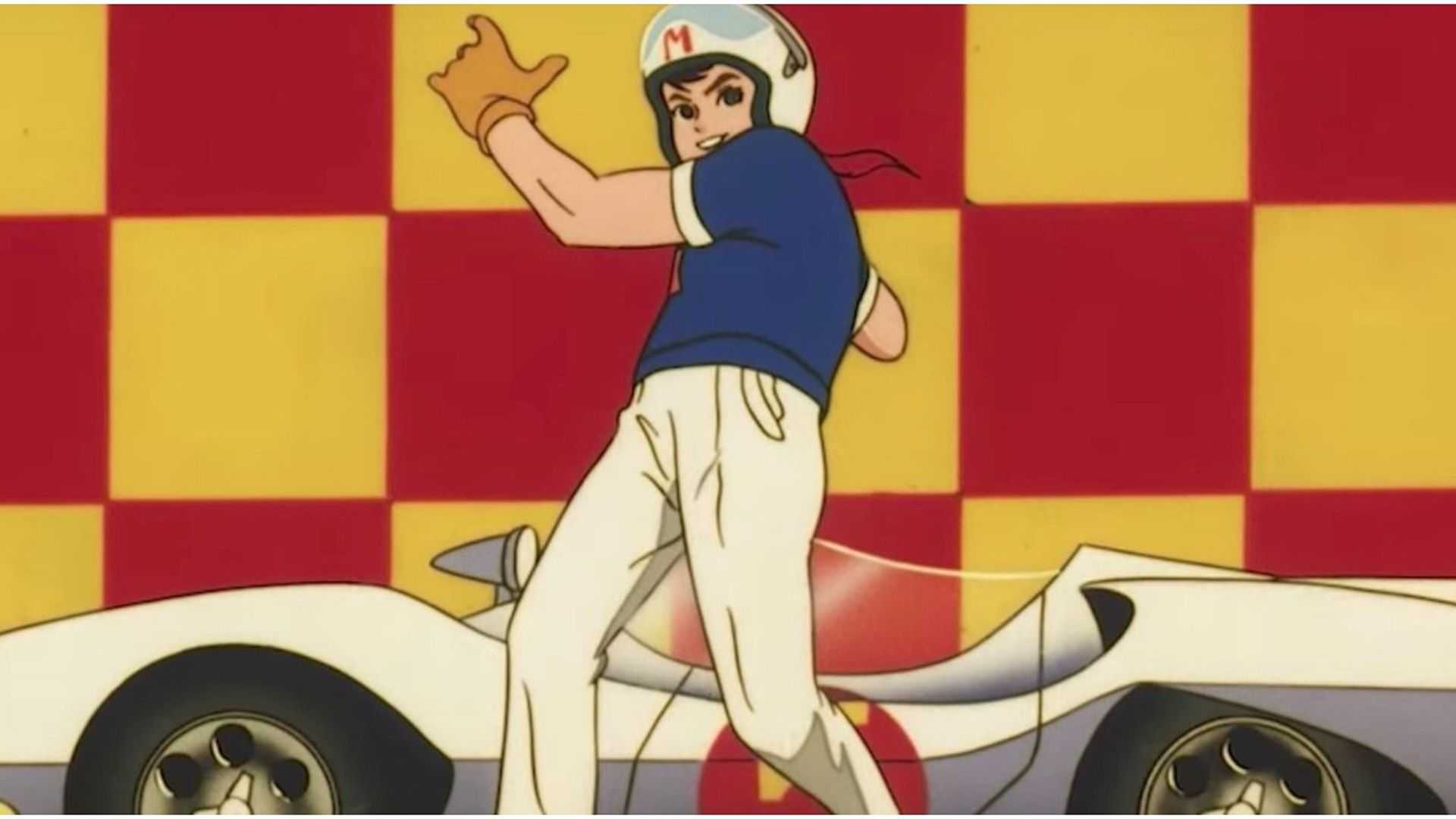 Speed Racer in front of his Mach 5 from the anime.