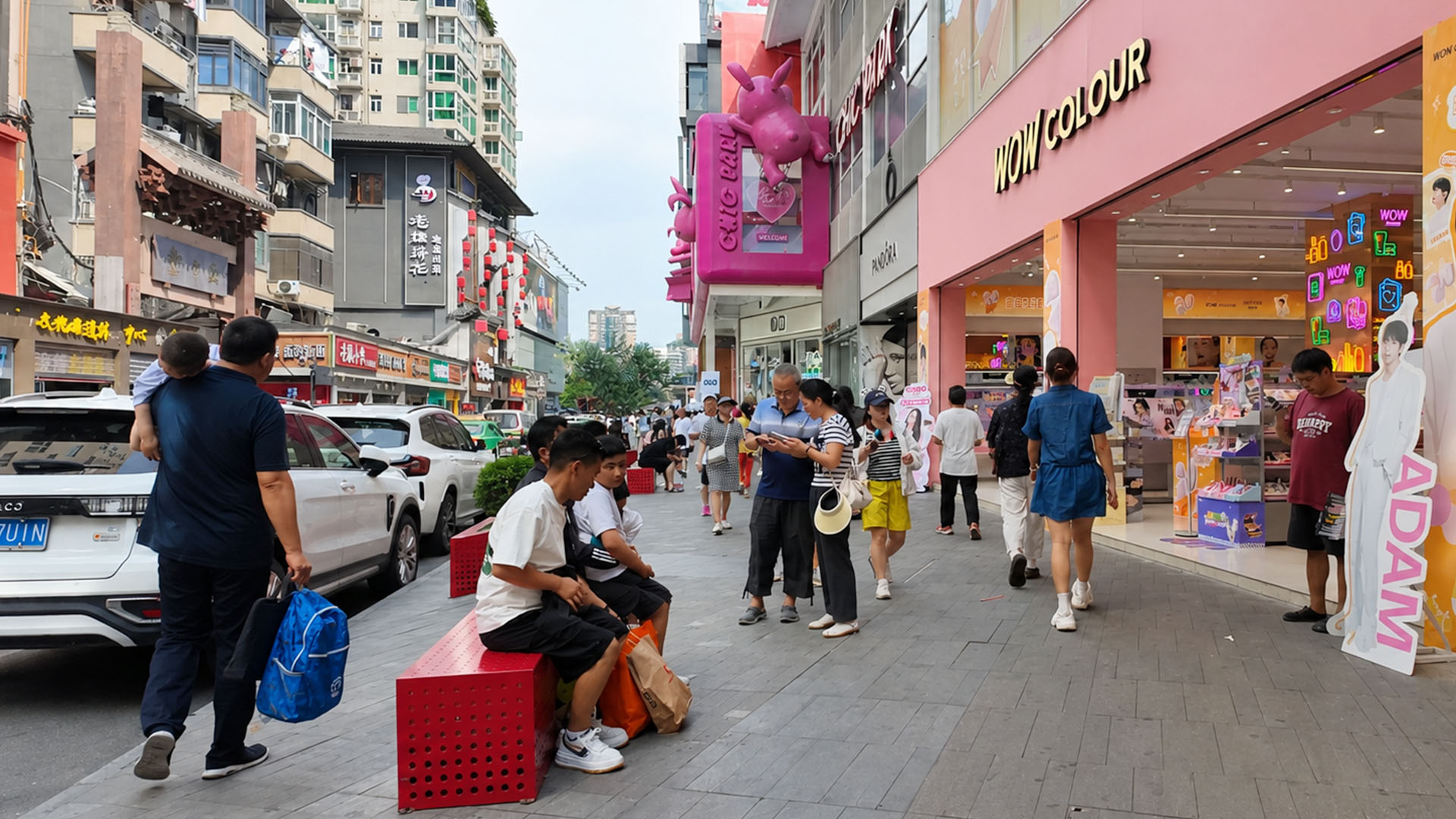 People gather along Chunxi Road for shopping dining and leisure activities