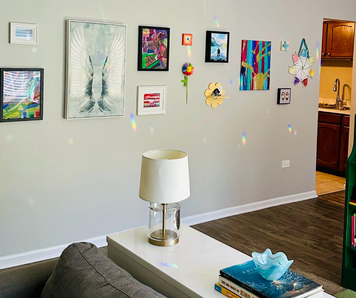 Pieces of artwork hanging on the writer's wall in her apartment.