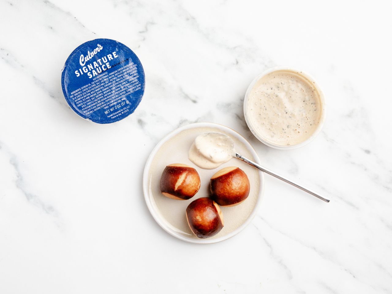 Culver's new signature sauce in the package and on a plate with pretzel bites