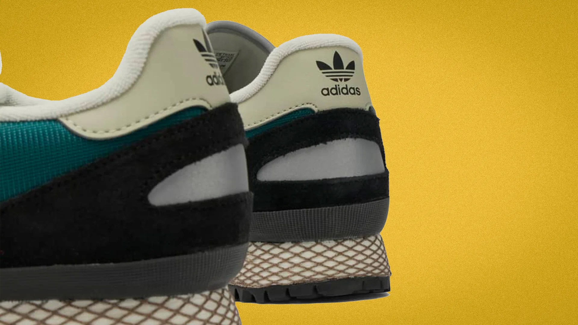Pair of Adidas sneakers with black suede, teal mesh, cream leather heel tab, and textured beige midsole on yellow background.
