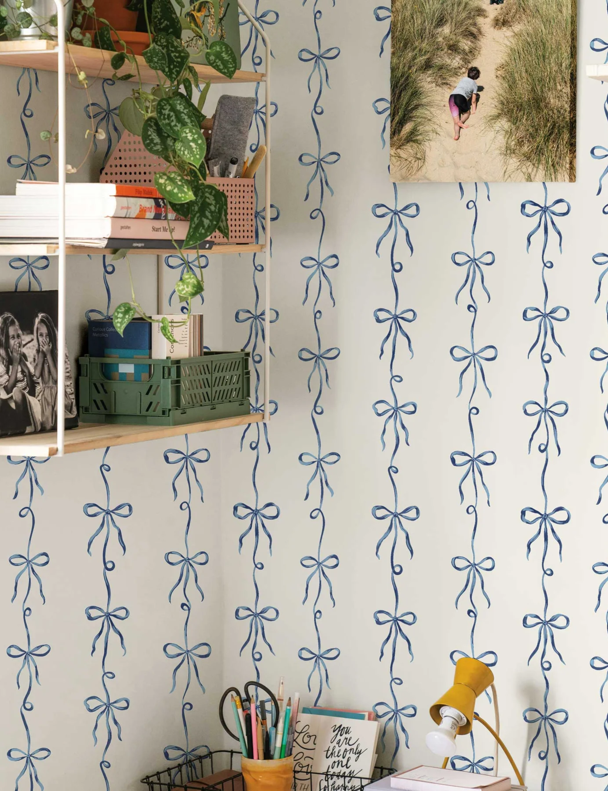 College dorm room featuring coquette bow motif temporary wallpaper