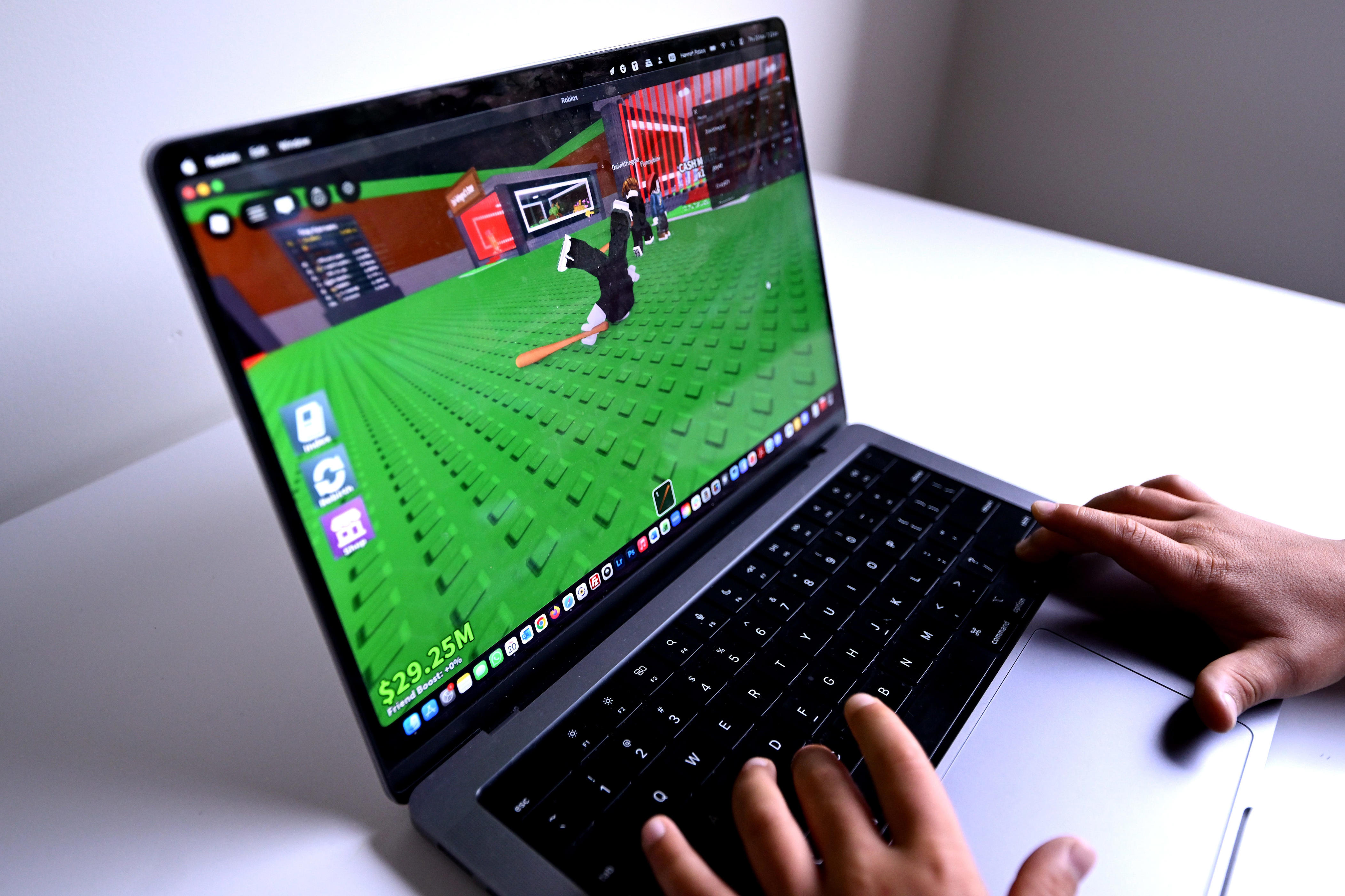 A Roblox player uses the game on a personal computer.