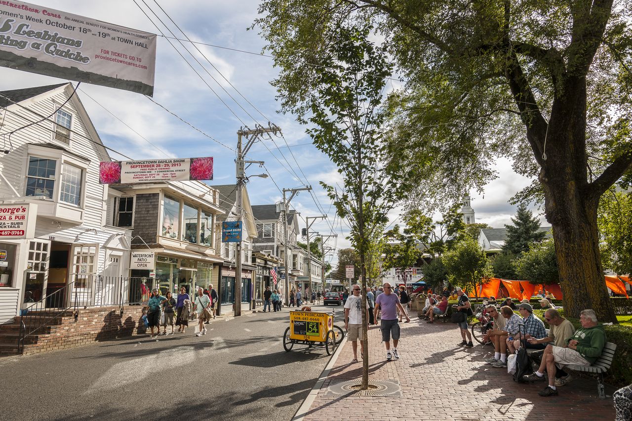 People strolling down a city street in Provincetown, Massachusetts