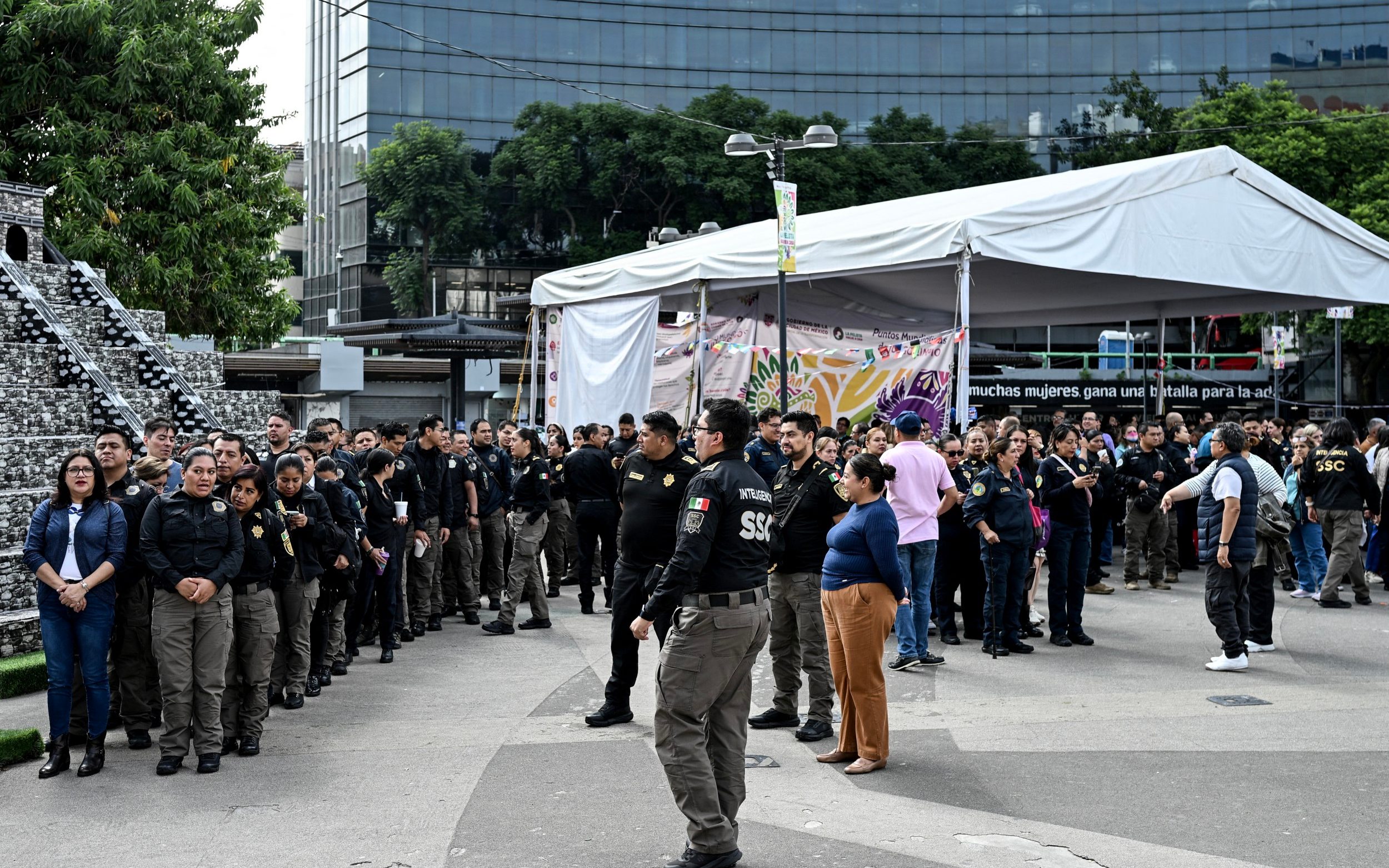 Workers from Mexico's Secretariat of Citizen Security stand outside the agency's headquarters