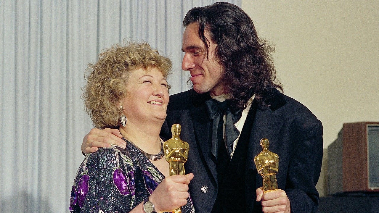 Brenda Fricker and Daniel Day-Lewis stand together at the Academy Awards in Los Angeles.