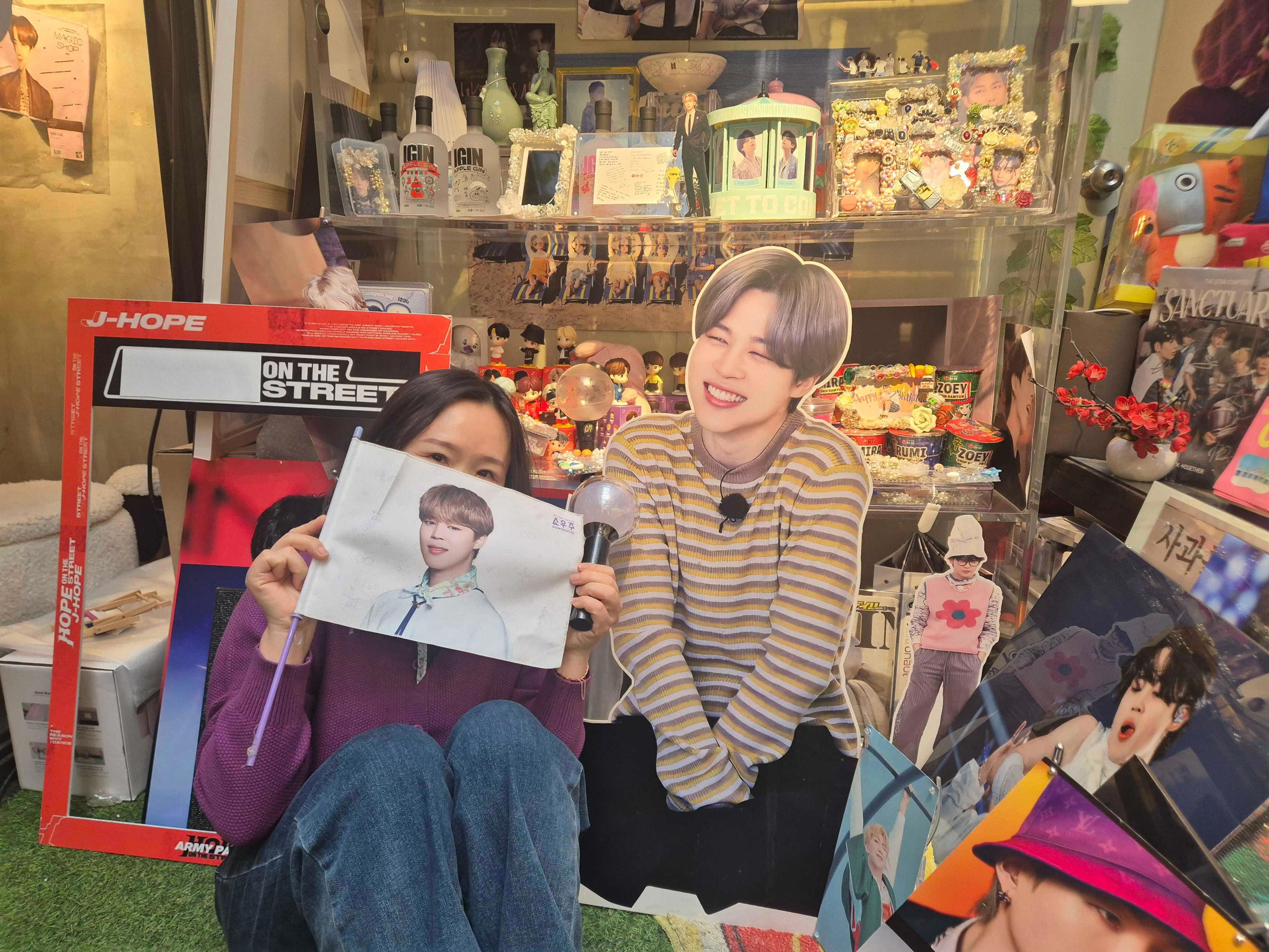 Yeon-su, pictured here at a BTS-themed café in Seoul, had not heard South Korean music before leaving her country