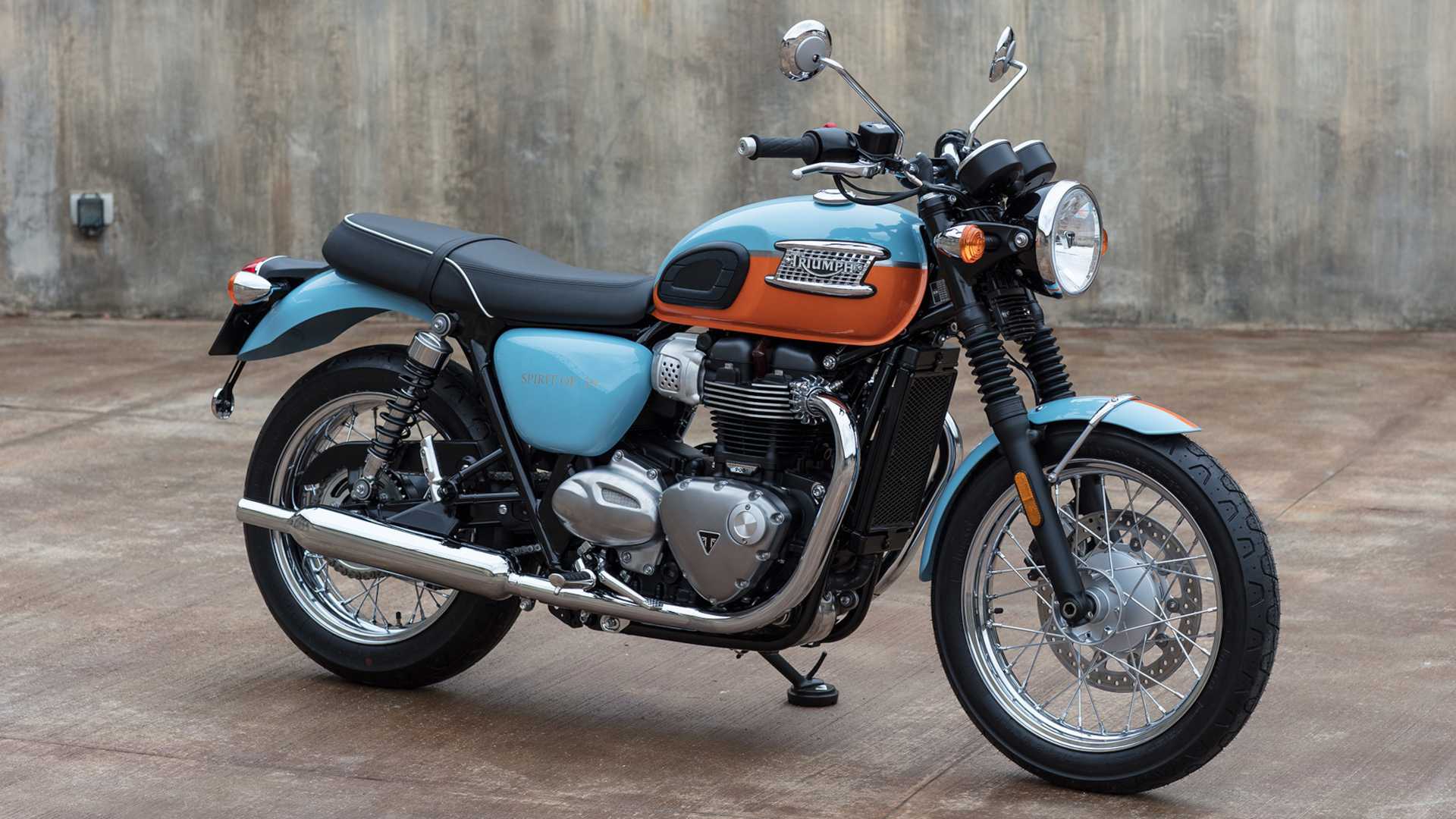 Front 3/4 shot of a Triumph Bonneville T100 standing in concrete garage