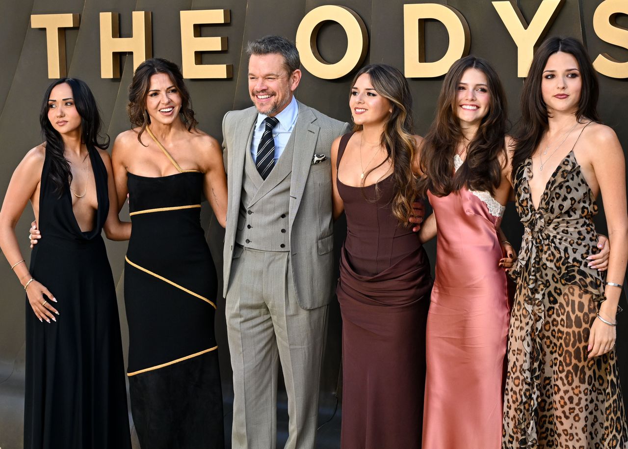 Matt Damon posing with a group of women at an event