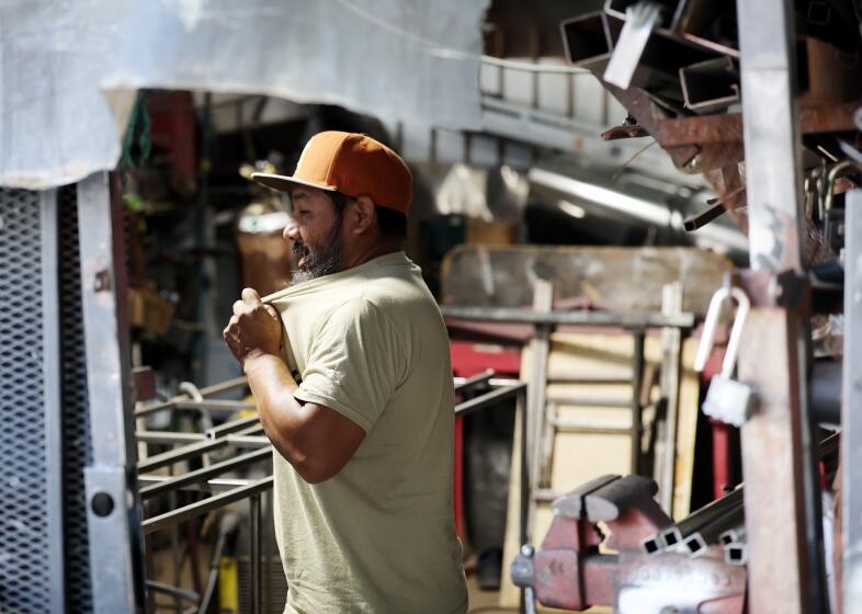 East LA resident Antonio Arcos has a coughing attack in Boyle Heights.