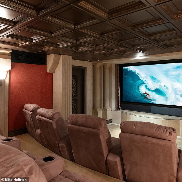 Another fun feature of the home is the plush home theater, which has numerous recliners to kick up your feet with a bowl of popcorn