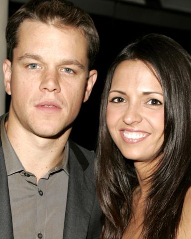 Matt Damon posing with a woman smiling