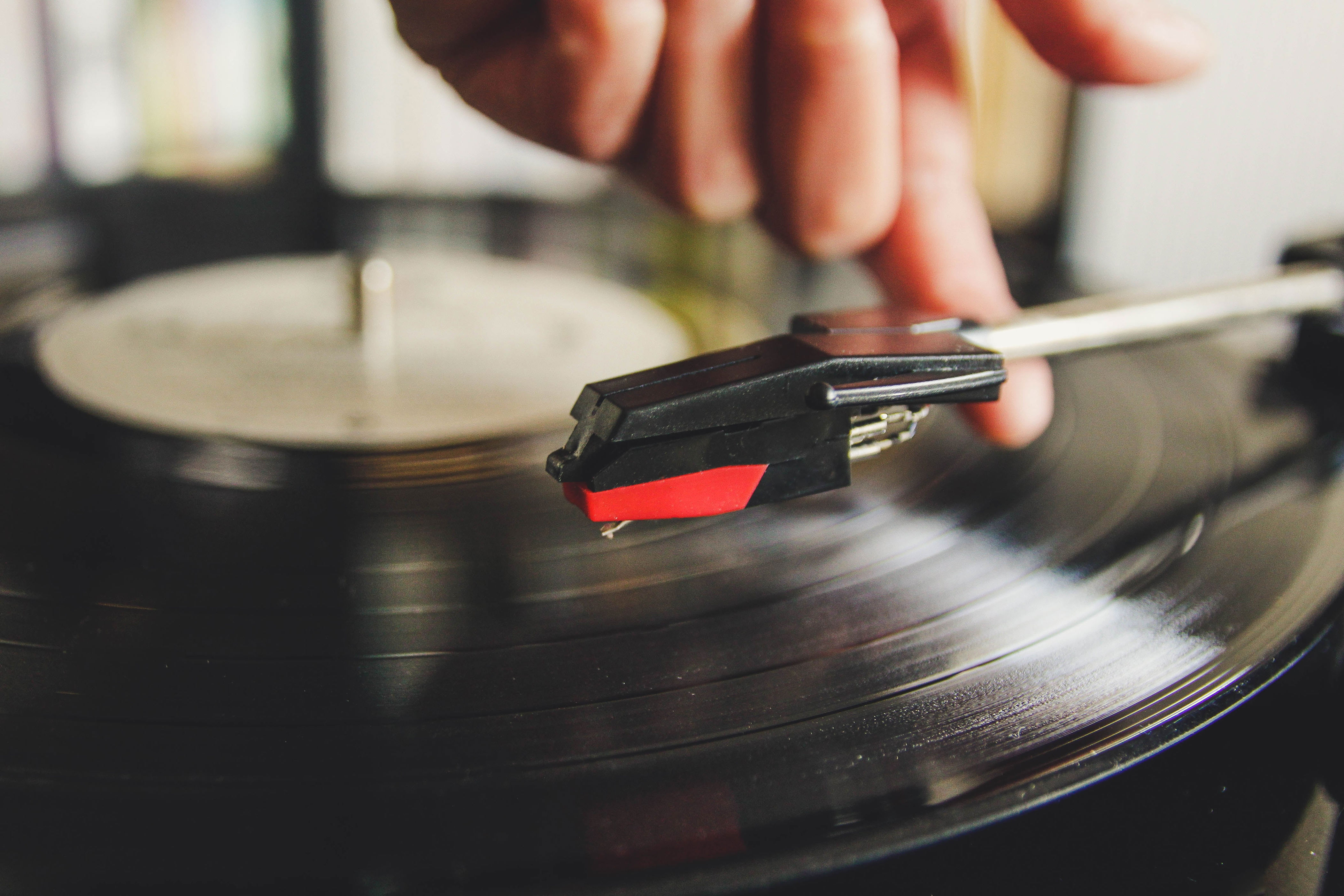A person playing a vinyl record
