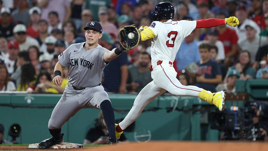 Ben Rice catches a ball at first base.