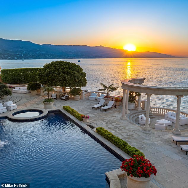 The outside of the home is equally as spectacular as the patio overlooking Malibu's famous cliffs has a resort-style swimming pool, spa and private access to one of the areas most coveted beaches