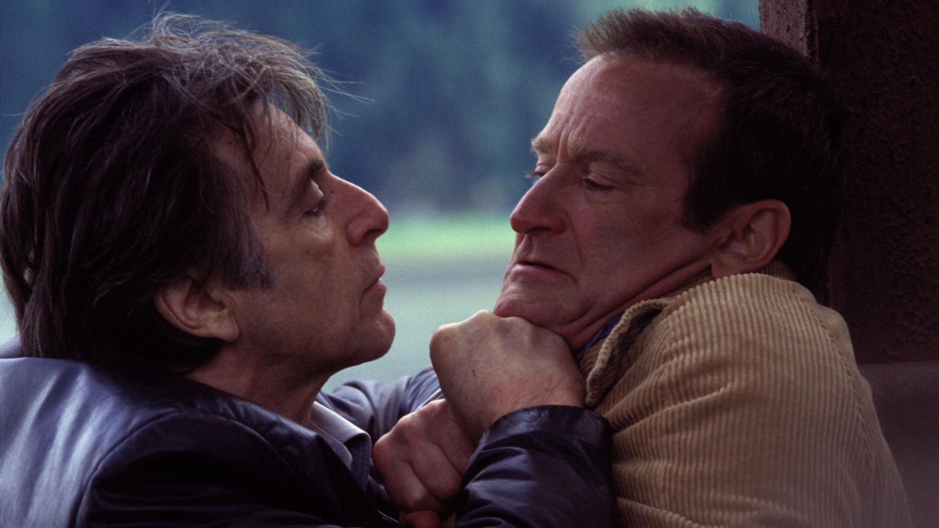 Al Pacino as Will Dormer and Robin Williams as Walter Finch during a heated scene in the Christopher Nolan movie, Insomnia
