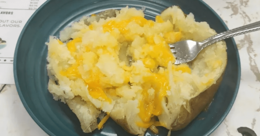 a baked potato with butter and cheese from a diner in Commerce, Georgia.