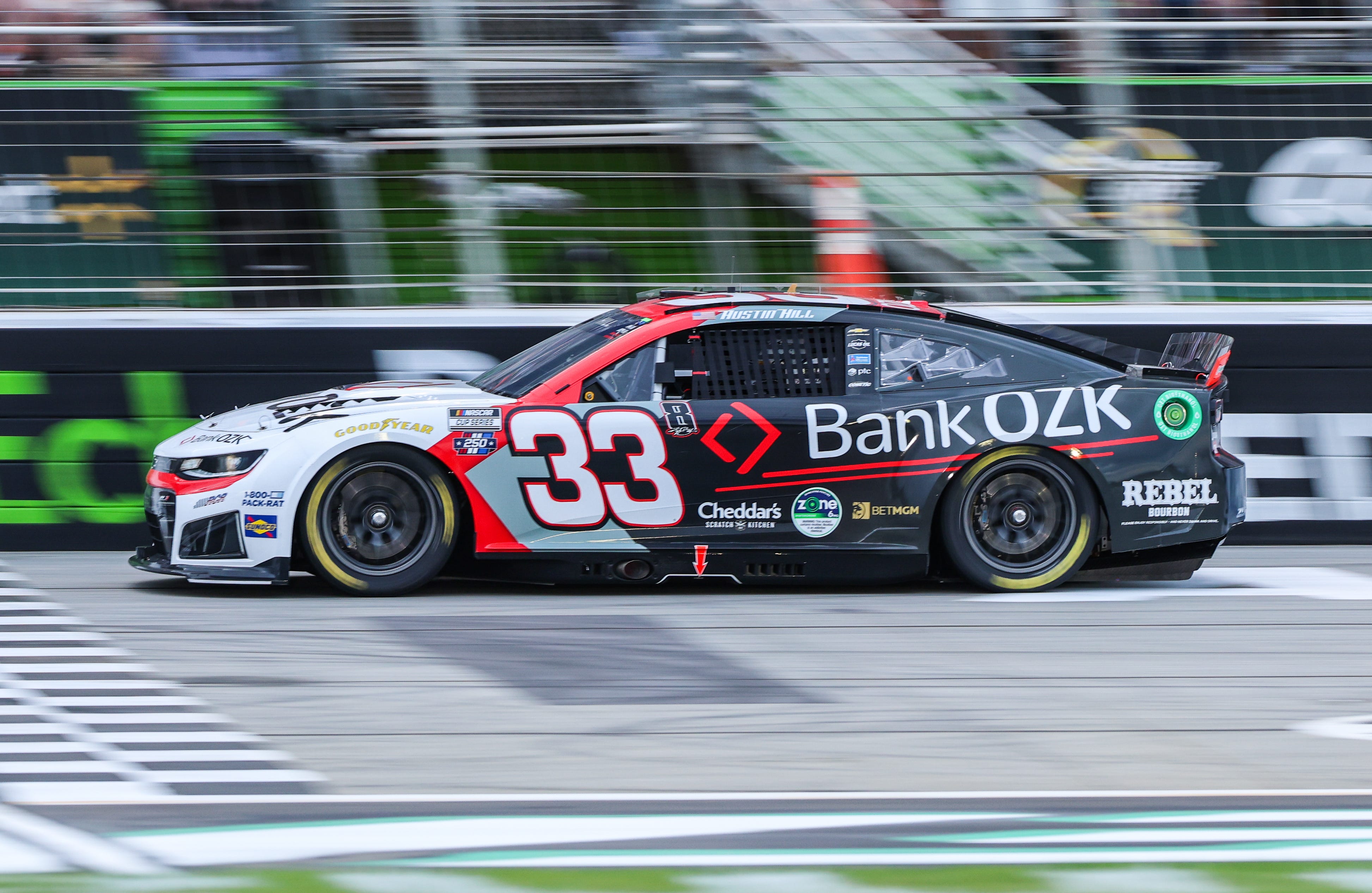Jul 12, 2026; Hampton, Georgia, USA; Bank OZK driver Austin Hill (33) races during the Quaker State 400 at EchoPark Speedway. Mandatory Credit: Jordan Godfree-Imagn Images