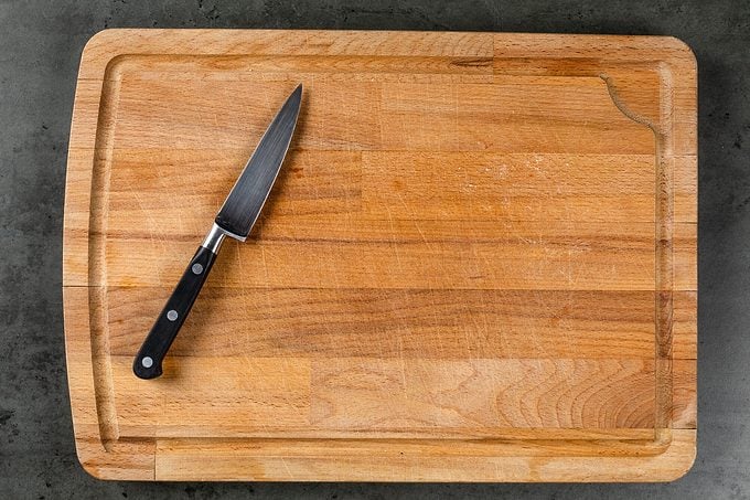 Small Kitchen Knife On Wooden Chopping Board