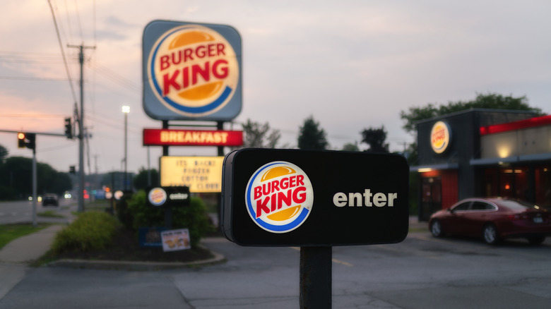 The entrance to a Burger King restaurant at dusk