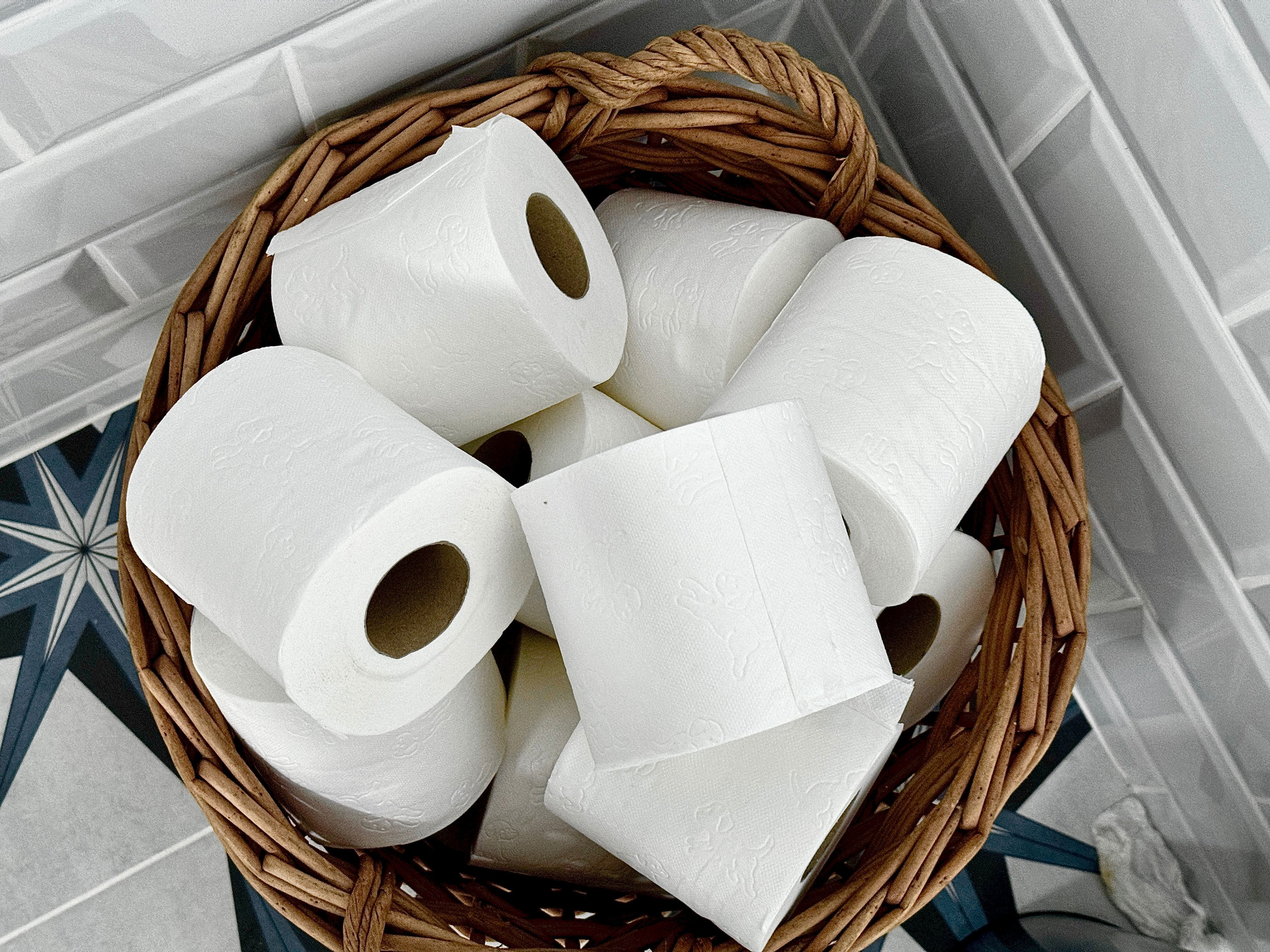 A basket filled with rolls of toilet paper
