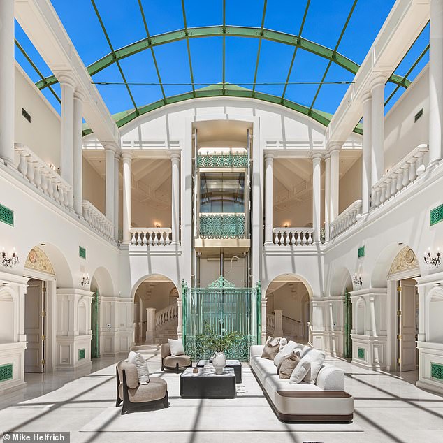 One of the most interesting features of the home is an elevator with wrought-iron detailing inside the mansion's two story ballroom