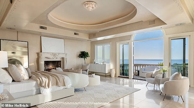 The luxurious primary suite comes complete with motorised rotating clothing carousels inside its dual dressing rooms, alongside a Roman-inspired bathroom