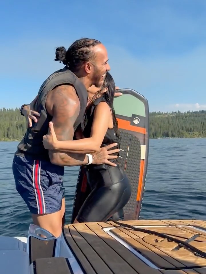 Lewis Hamilton embraces Kim Kardashian on a boat.