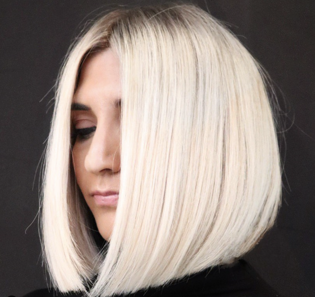 Woman with a sleek platinum bob