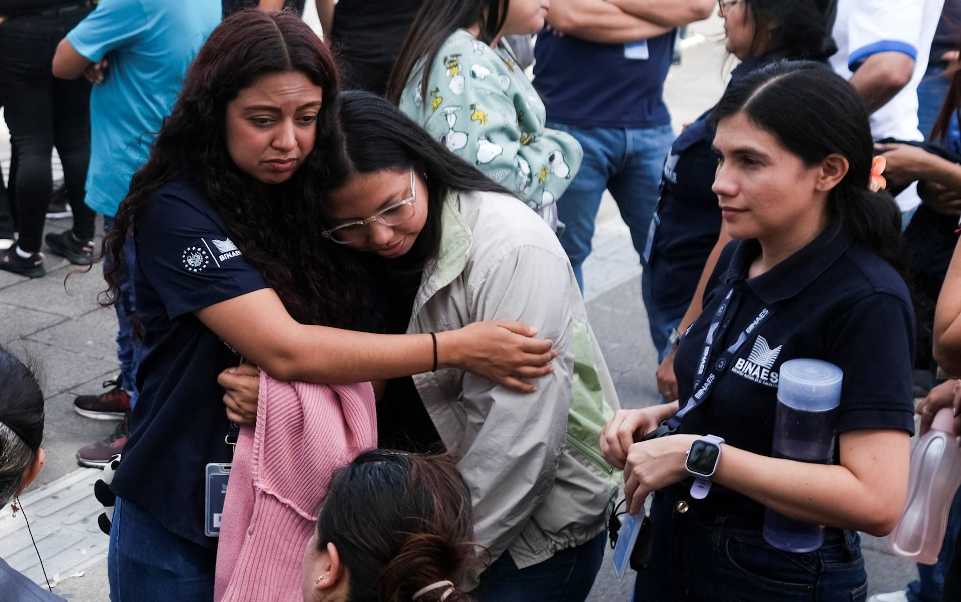 People react after evacuating the national library in San Salvador, El Salvador