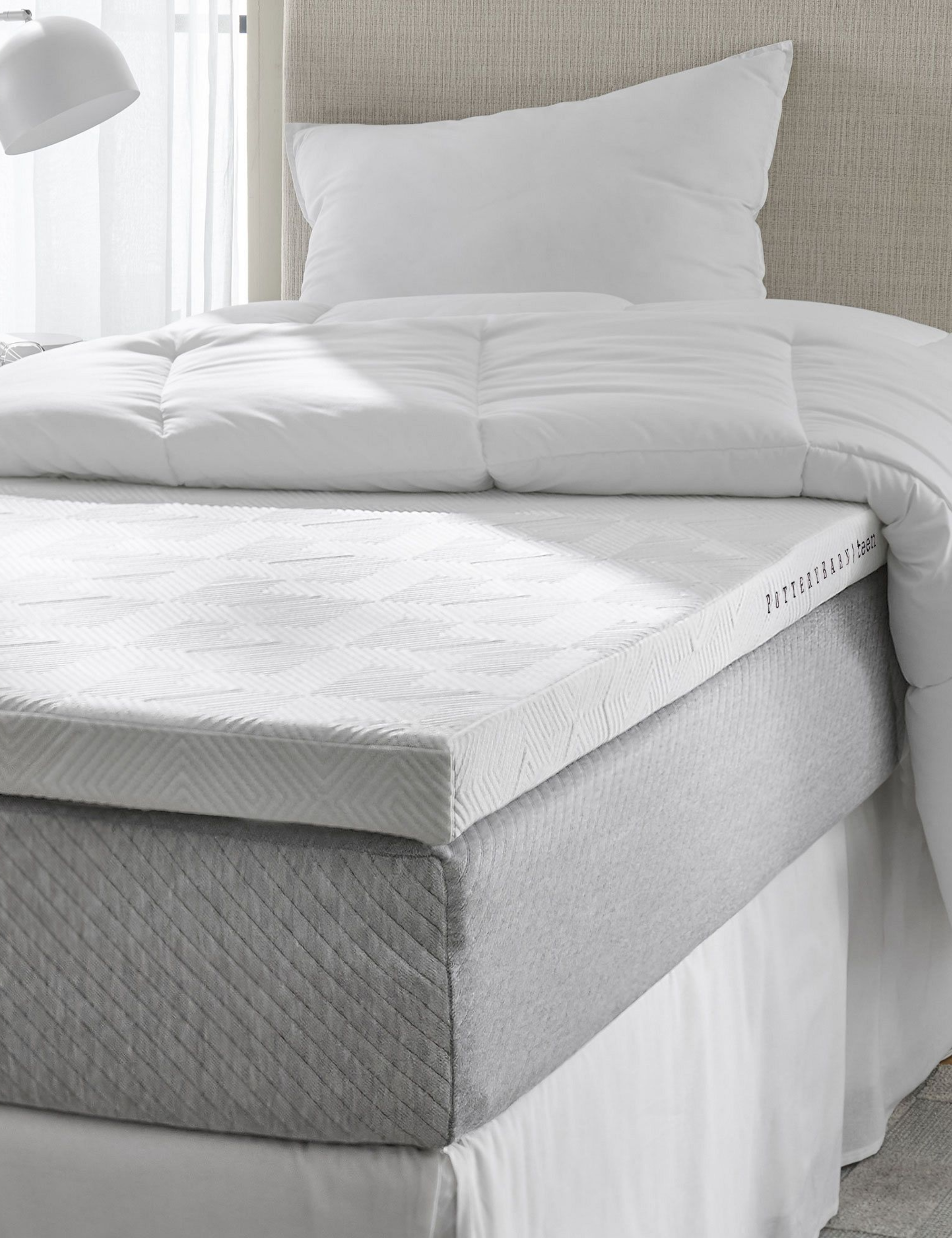 Soothing dorm room featuring an exposed gel mattress topper for a Twin XL bed