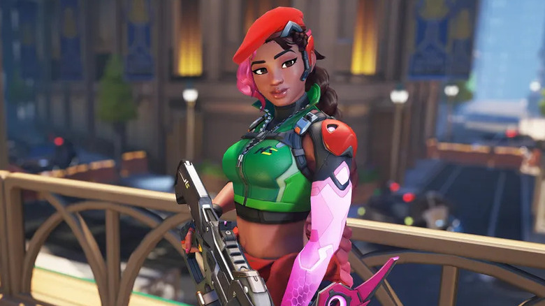 Sierra holds a gun while overlooking a city in "Overwatch" (2023)