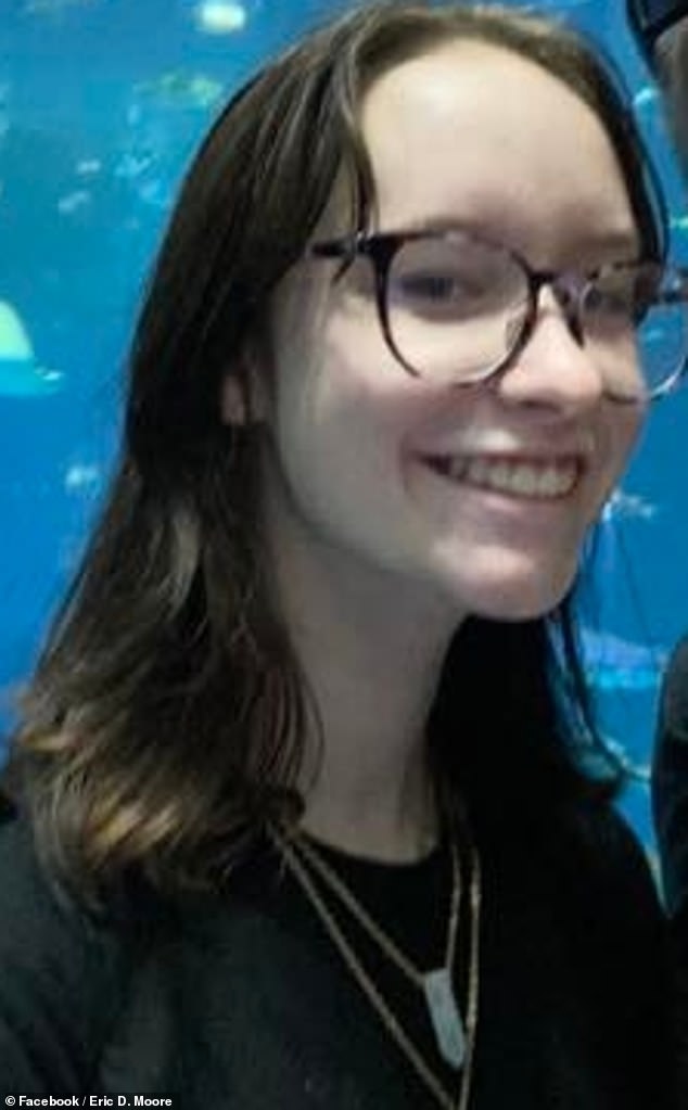 Moore claims that she had no idea she was pregnant before she suddenly fell ill in her dorm, throwing up and laying on the floor in pain before her screaming bay fell down next to her. She is seen in a Facebook photo above