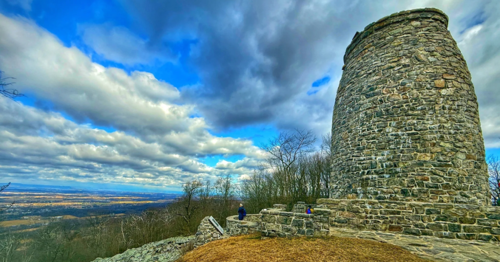 The stone Washington Monument tower overlooking the valley at Washington Monument State Park, Maryland.