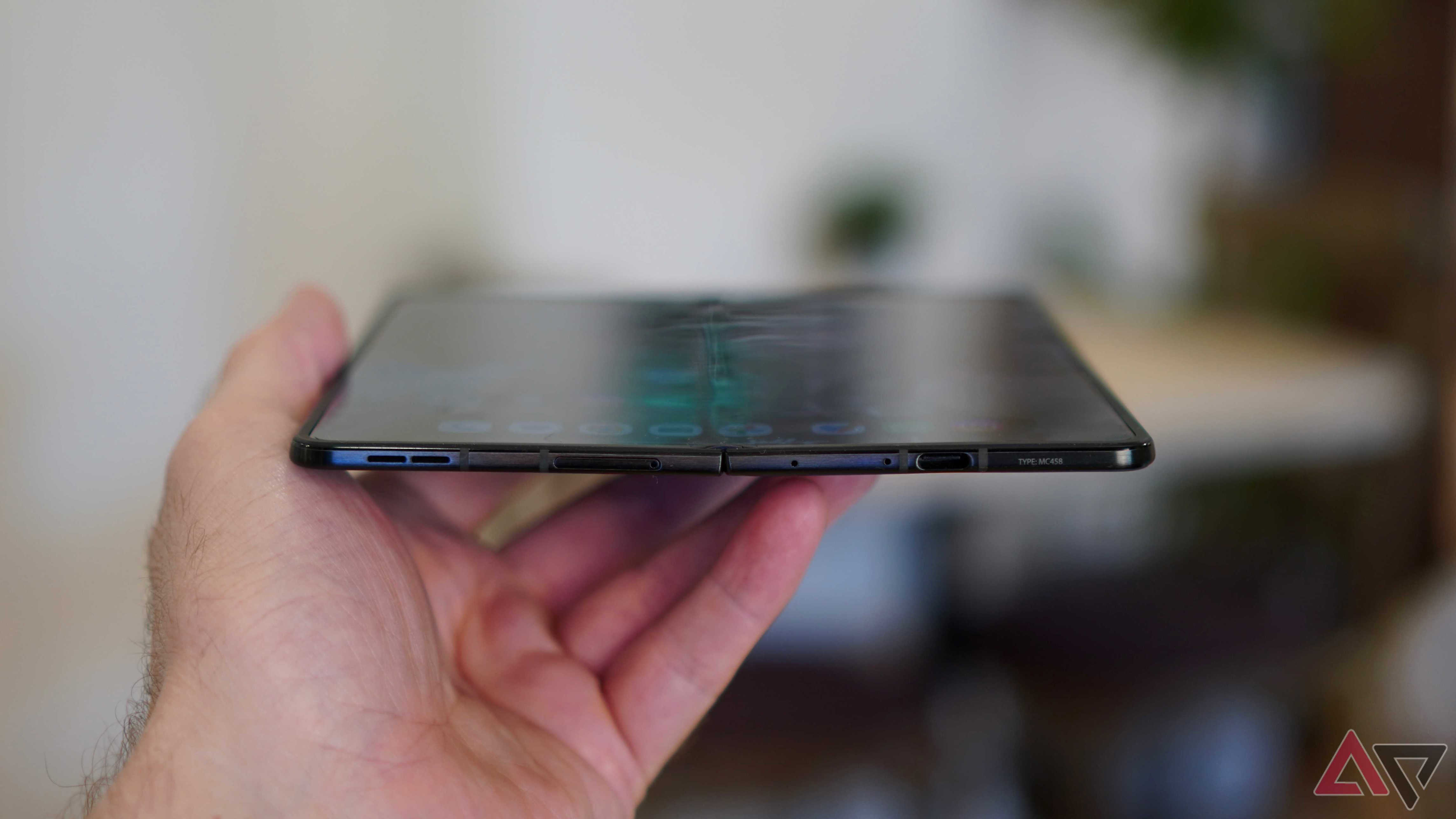 A person holding the open Motorola Razr Fold