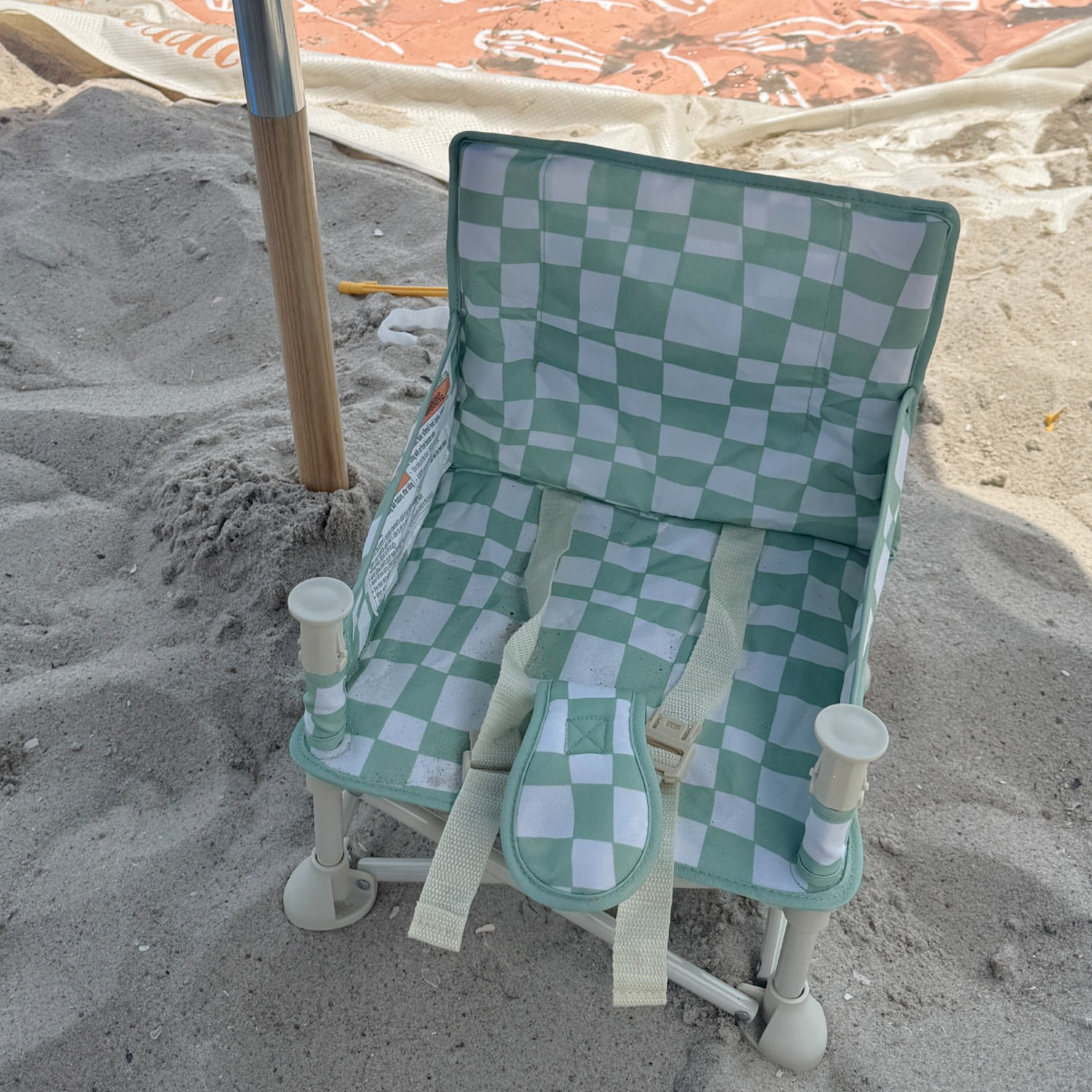 Izimini Booster chairs are cute and easy to set up, buckle for safety and come with a tray for meal time. (Courtesy Becca Delman)