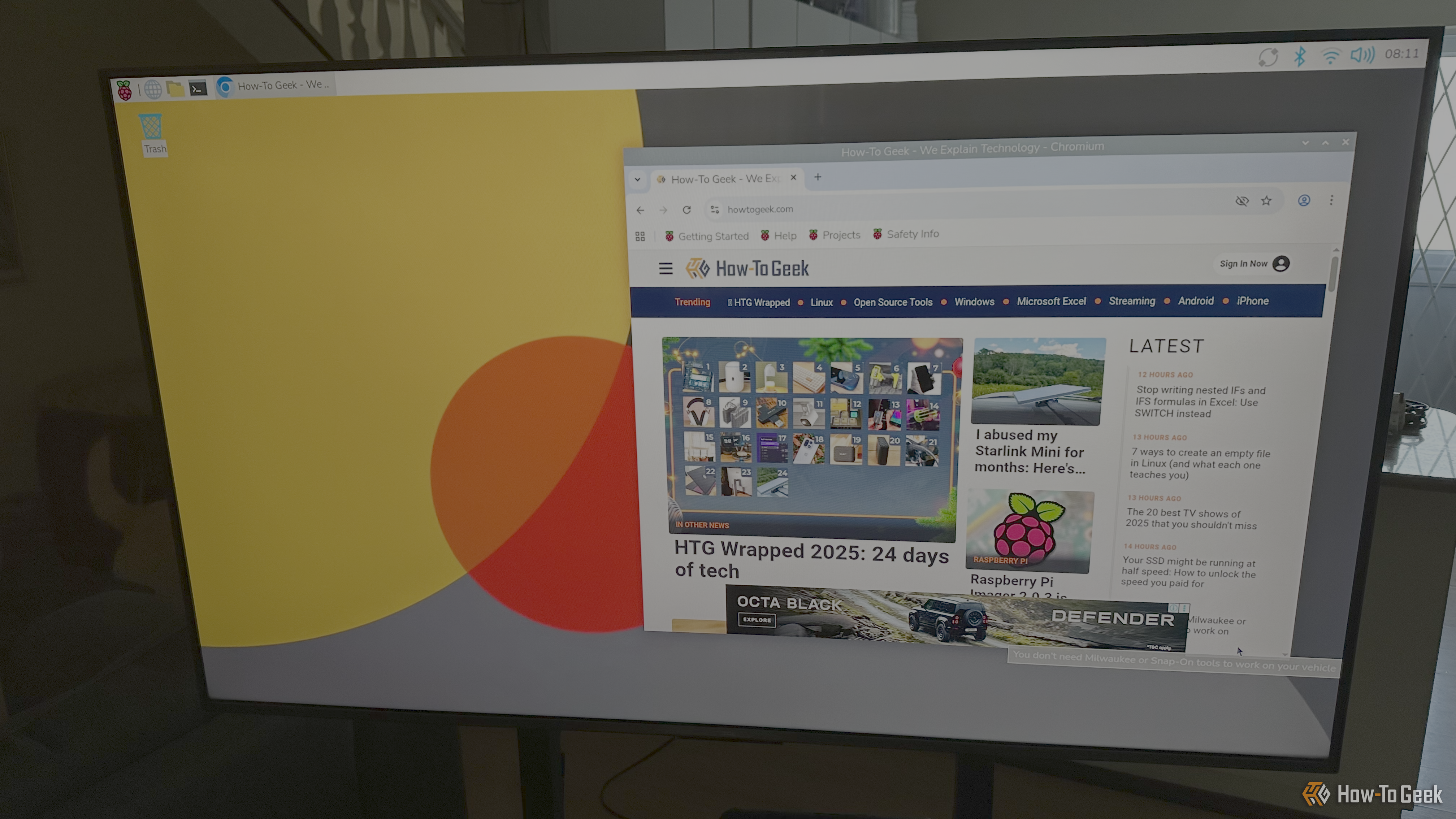The Raspberry Pi OS visible on a TV screen.