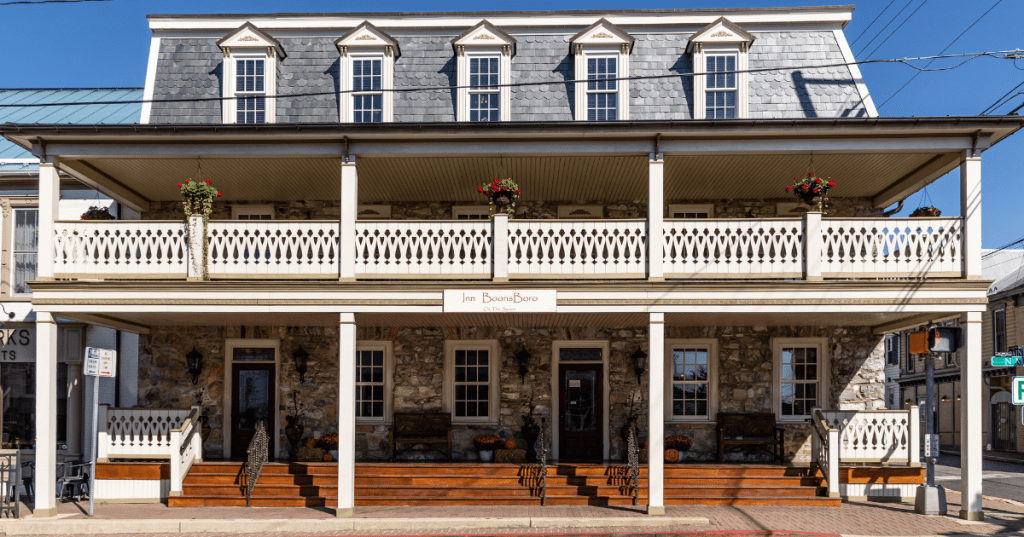 Inn BoonsBoro, a historic stone boutique inn with a wraparound porch on the town square in Boonsboro, MD.