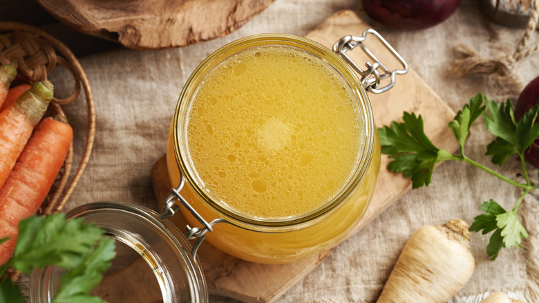 Chicken broth in glass jar from above