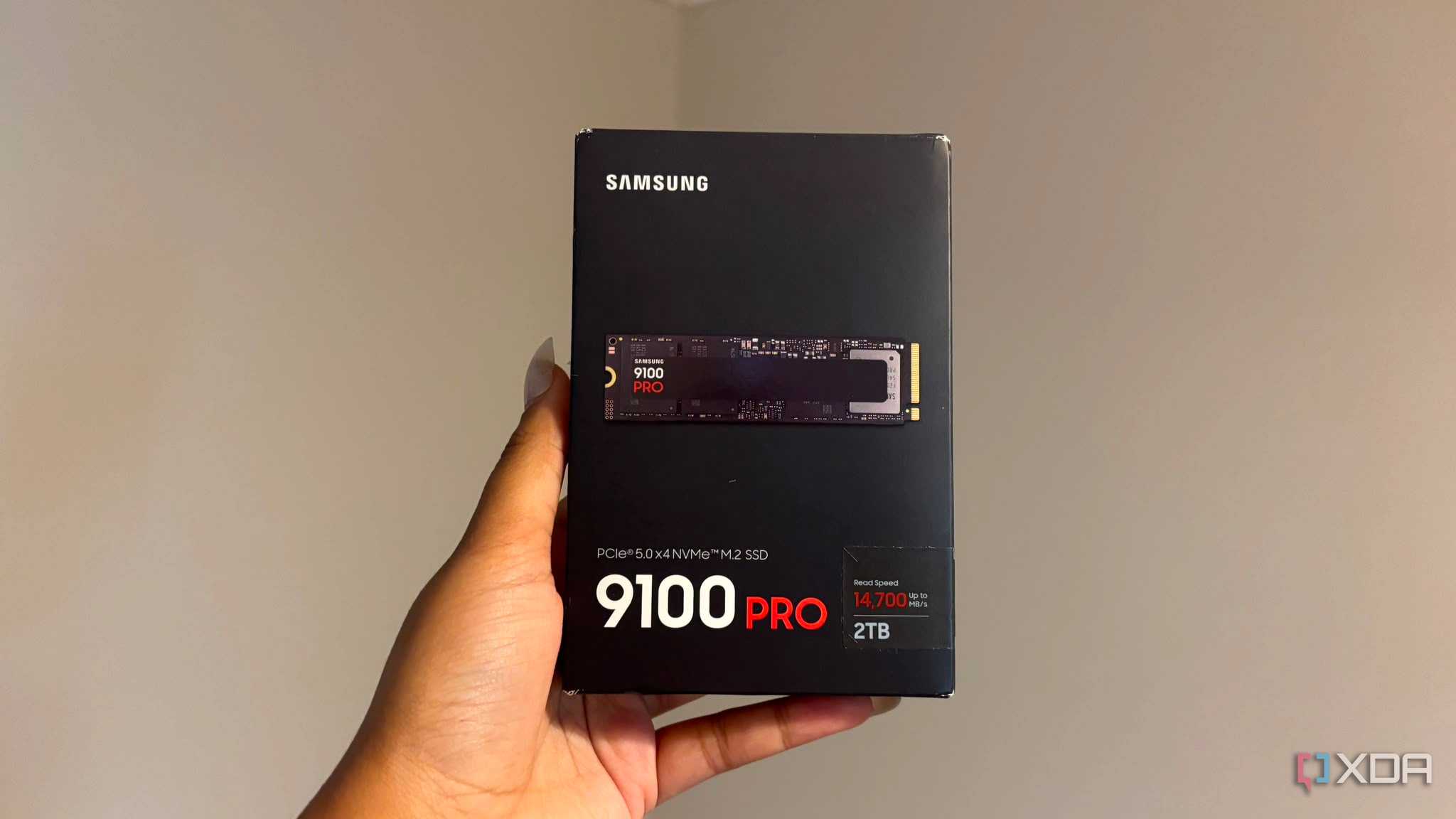 Samsung 9100 pro SSD box being held up