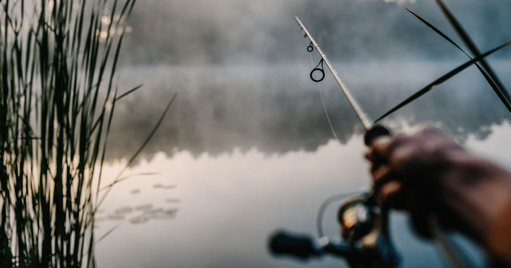 A fisherman casts a line into a hidden lake in Virginia.