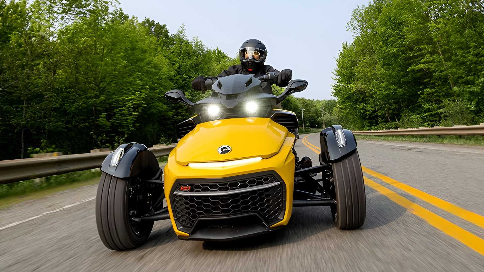 Can-Am Spyder F3-S in yellow on the road front fascia cinematic shot